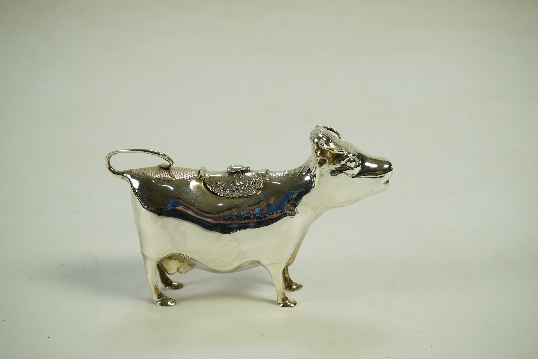 An Elizabeth II silver cow creamer by William Comyns & Sons Ltd